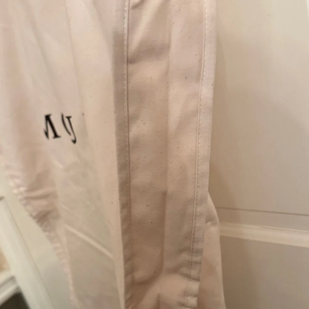 New McQueen Cream Garment Bag with hanger